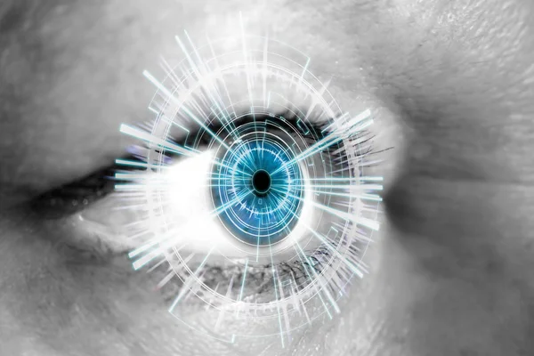Olho de uma mulher com interface digital — Fotografia de Stock
