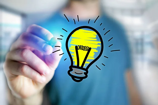 Hombre mano dibujo bombilla icono de la lámpara en una interfaz futurista - tecnología —  Fotos de Stock
