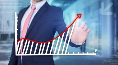 Grafik arayüzü tutan işadamı