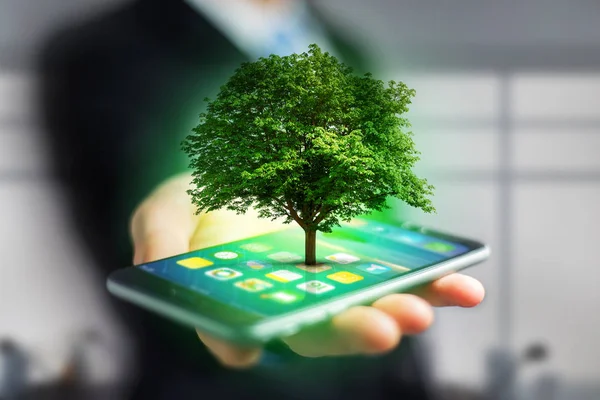 Gröna träd går ut från en smartphone — Stockfoto