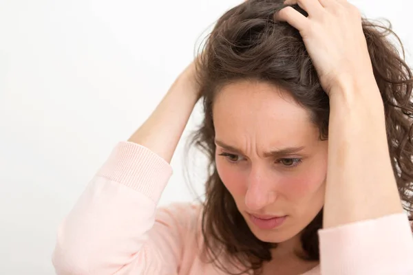 Young woman having a headache due to stress and anxiety — Stock Photo, Image