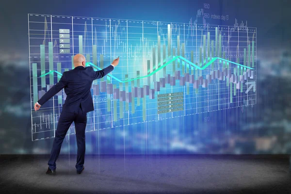 Businessman in front of a wall with  3d render Stock exchange tr — Stock Photo, Image