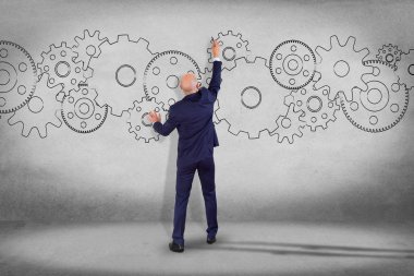 İşadamı ve Dişli tekerlekleri duvar