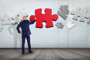 işadamı ve bulmaca parçaları duvar