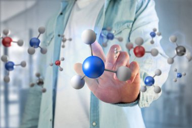 Atom modelleri işaret eden adam