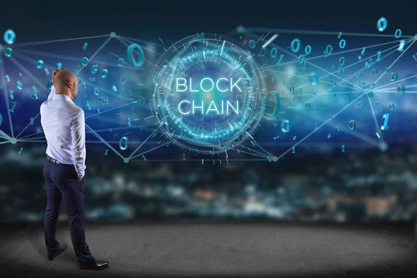 Businessman in front of a wall with blockchain — Stock Photo, Image