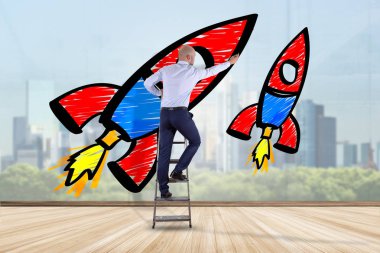 İşadamı bir Derma çizim bir duvarın önünde başlatmak roket - iş kavramı