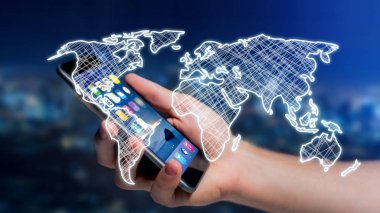 El çekilmiş dünya haritası üzerinde futuristik bir arayüze sahip Smartphone kullanarak iş adamı