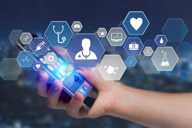 Tıbbi ve genel sağlık simgelerinin el smartphone üzerinde