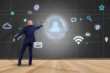 Bir işadamı app ve sosyal simge tarafından - 3d render çevreleyen bir kişi simgesi ile bir duvar önünde görünümünü 