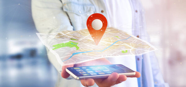 View of a Man holding a 3d rendering pin holder on a map