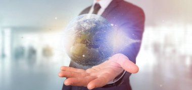 Parçacıklar dünya küre işleme 3d tutan bir işadamı görünümünü 