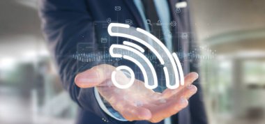Her yerde verilerle WiFi simgesi tutan işadamı