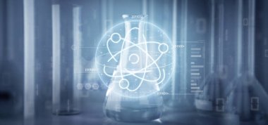 Laboratuvar arkaplanındaki verilerle çevrili bir atom simgesinin görüntüsü