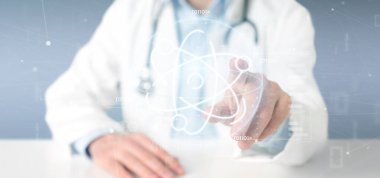 Doktor, kliniğe steteskop kullanarak işaret etti.