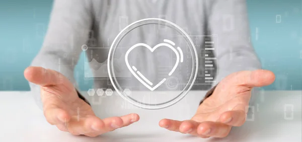 Empresário segurando um ícone do coração cercado por dados — Fotografia de Stock