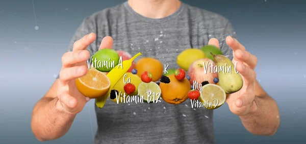 Elinde meyve ve vitamin tutan bir işadamı - 3D görüntüleme — Stok fotoğraf