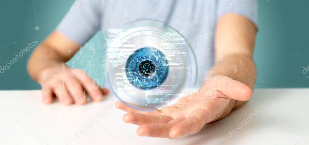 Businessman holding a visual recognition eye concept with data -