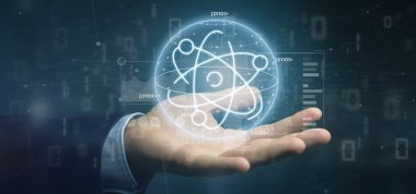 Veri ile çevrili bir atom simgesi tutan işadamı