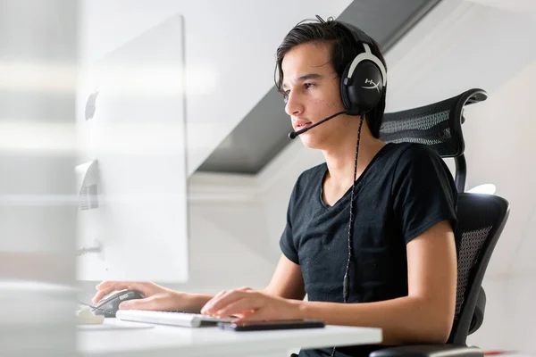 Teenager boy using technology to learn and communicate with others