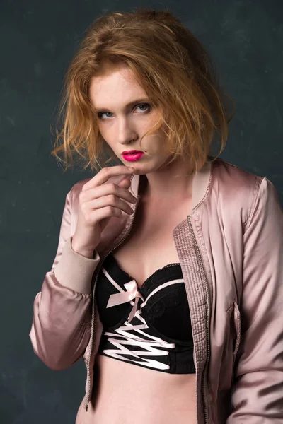 Redhead in pink and black — Stock Photo, Image