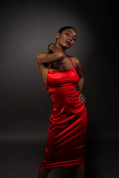 Slim black woman in red 스톡 사진