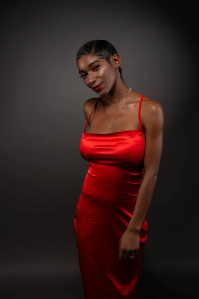 Slim black woman in red Stock Photo