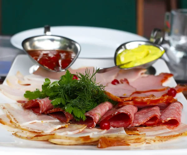 Assortment of sausages and sauce — Stock Photo, Image