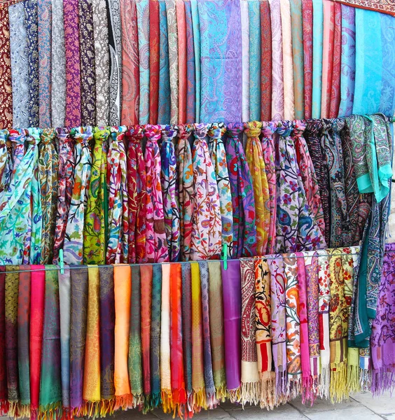 Handmade fabric of different colors on showcase — Stock Photo, Image