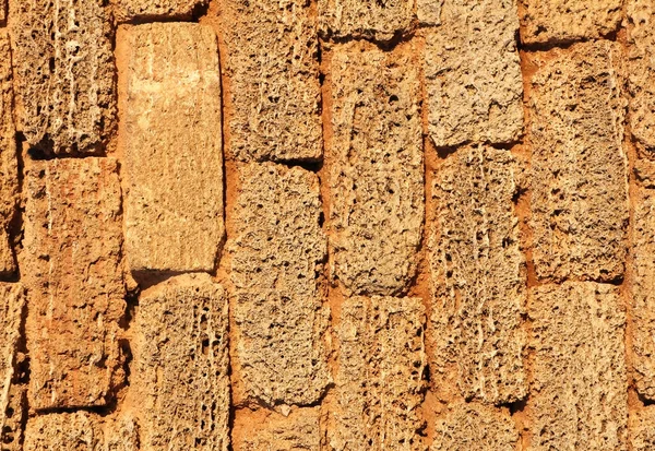 Part of the old brown brick - foam block wall, texture — Stock Photo, Image