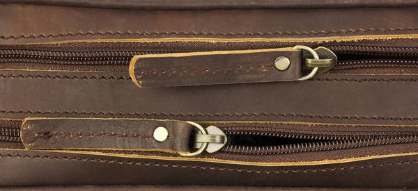 Pair of zippers on the leather bag, top view, one behind — Stock Photo, Image