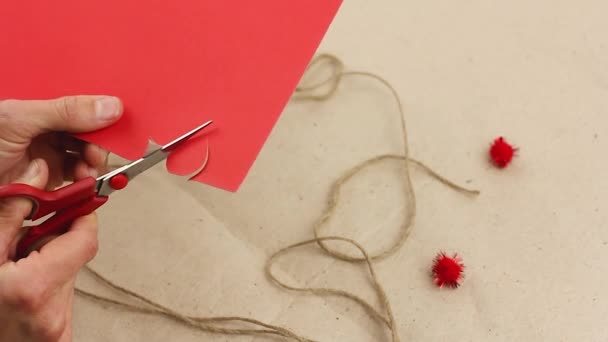 Man Cuts Out Smal Red Paper Heart Scissors Trim Edges — Stock Video