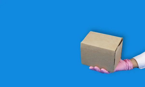 Right Hand Pink Medical Glove Holds Cardboard Box Concept Safety — Stock Photo, Image