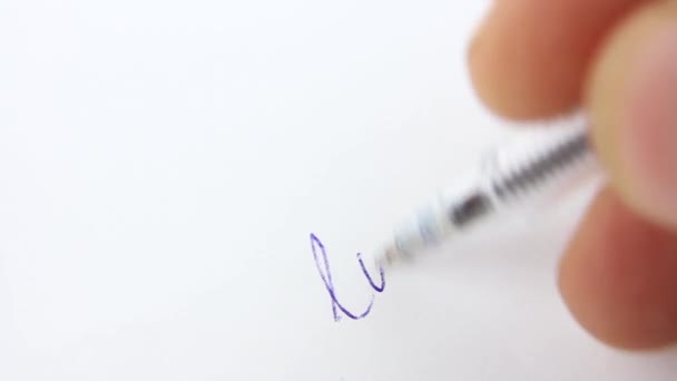 Close Hand Blue Ballpoint Pen Writes Word Love White Paper — Stock Video