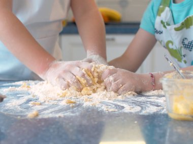 Two children cooking together