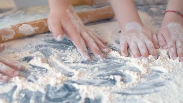 Four childrens hands playing with flour — Stock Video