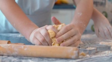 Girls hands preparing dough