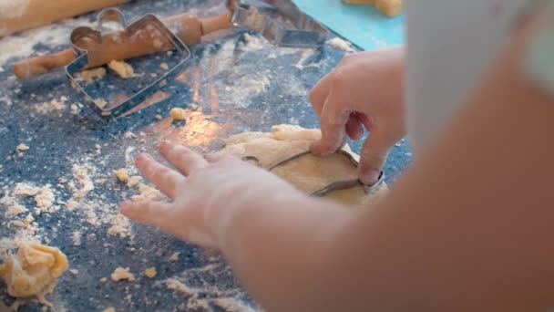 Girl making cookies with a cookie cutter — Stock Video