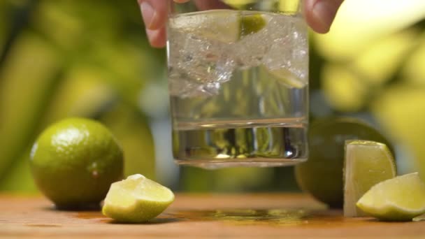 Hand shaking a glass of soda water — Αρχείο Βίντεο