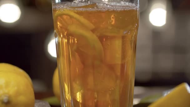 Close Tea Pouring Glass Ice Lemon Glass Iced Tea Cocktail — Stock Video