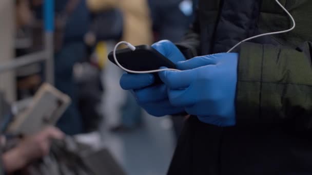 Man with smart phone in protective glove — Stock Video