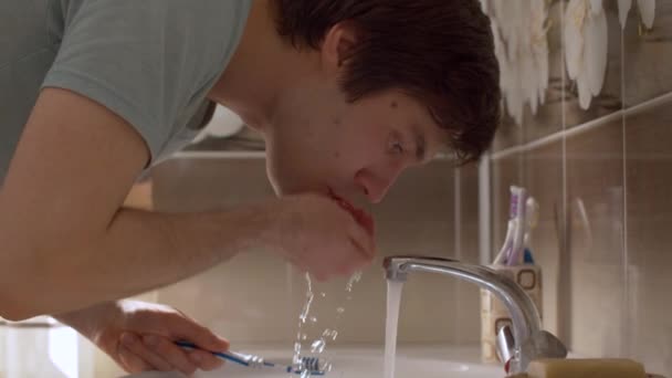 Man Brushes His Teeth Beautiful Bathroom Close Young Man Rinses — Stock Video