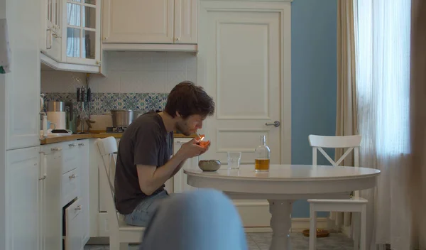 Drunk Man Lights Cigarette Man Drinking Alcohol Home Kitchen — Stock Photo, Image