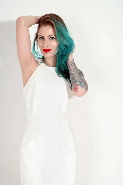 Beautiful tattooed woman with red lipstick isolated on white — Stock Photo, Image