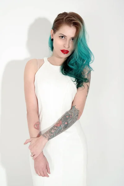 Beautiful tattooed woman with red lipstick isolated on white Royalty Free Stock Photos