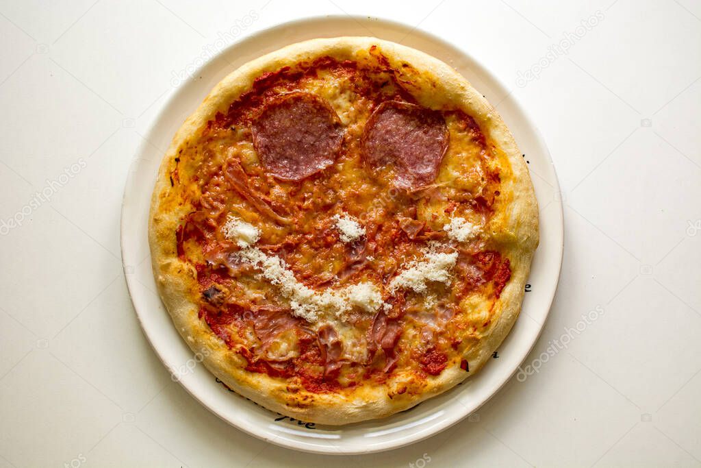 Pizza smile with salami and prosciutto cotto