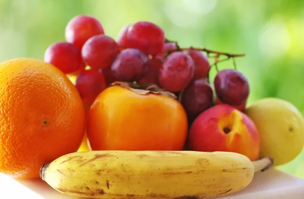 Bunch of grapes and ripe fruits — Stock Photo, Image