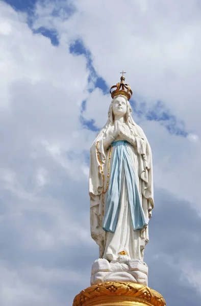 Our Lady, Virgin Mary, Mother of God in cloud sky