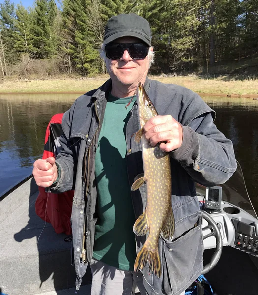 Fisherman poses with a Northern Pike — Stock Photo, Image