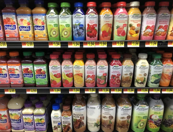 Several bottles of Smoothies on a store shelf — Stock Photo, Image